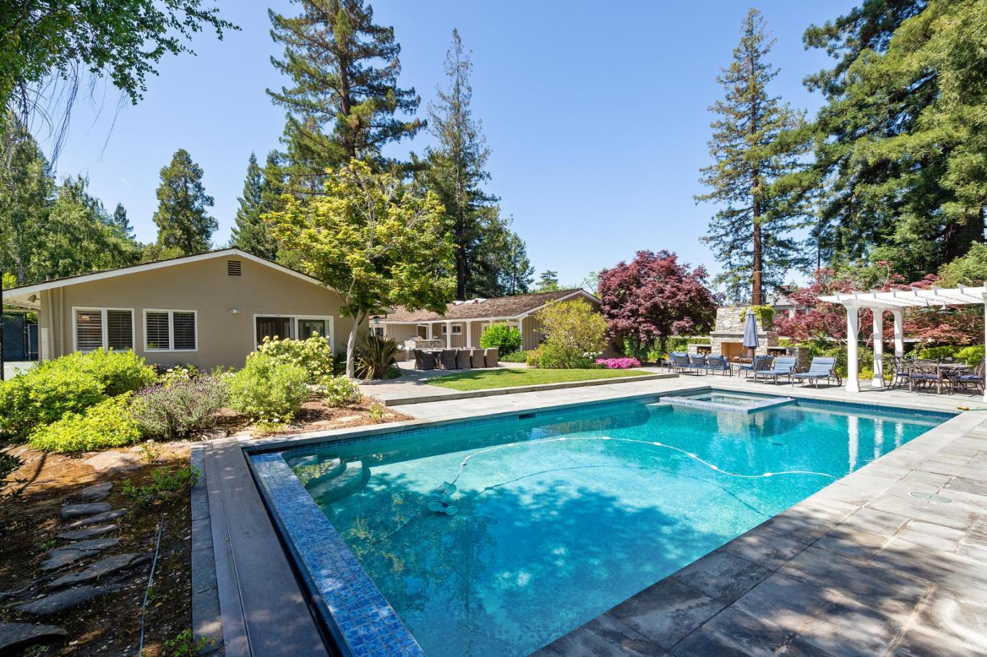 261 Atherton Avenue Atherton, CA 94027 - Photo 31 of 49 a view of house with swimming pool next to a yard