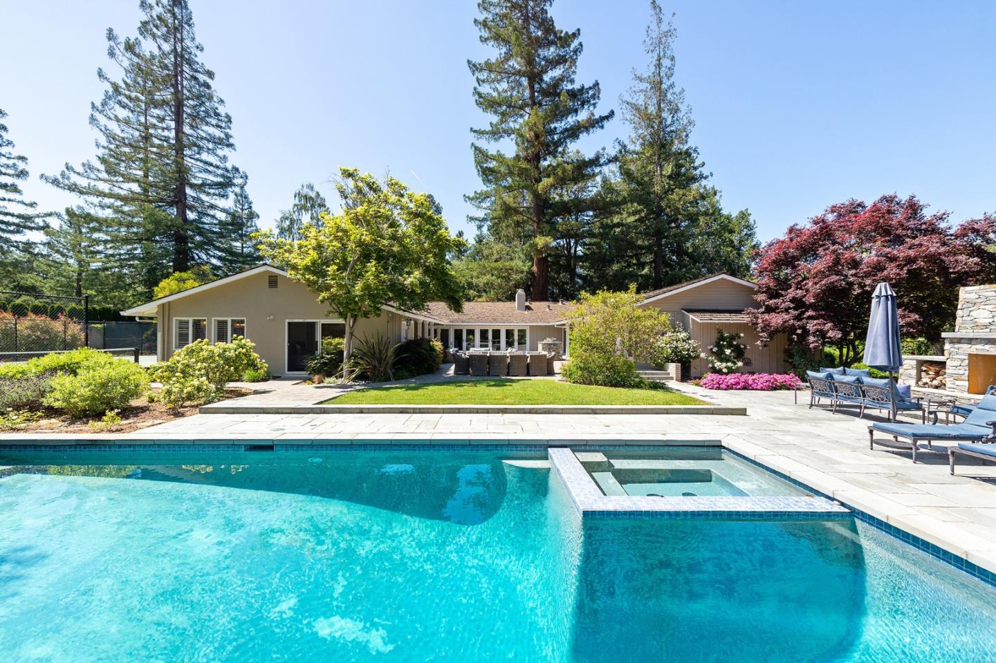 261 Atherton Avenue Atherton, CA 94027 - Photo 32 of 49 a view of a house with swimming pool and sitting area