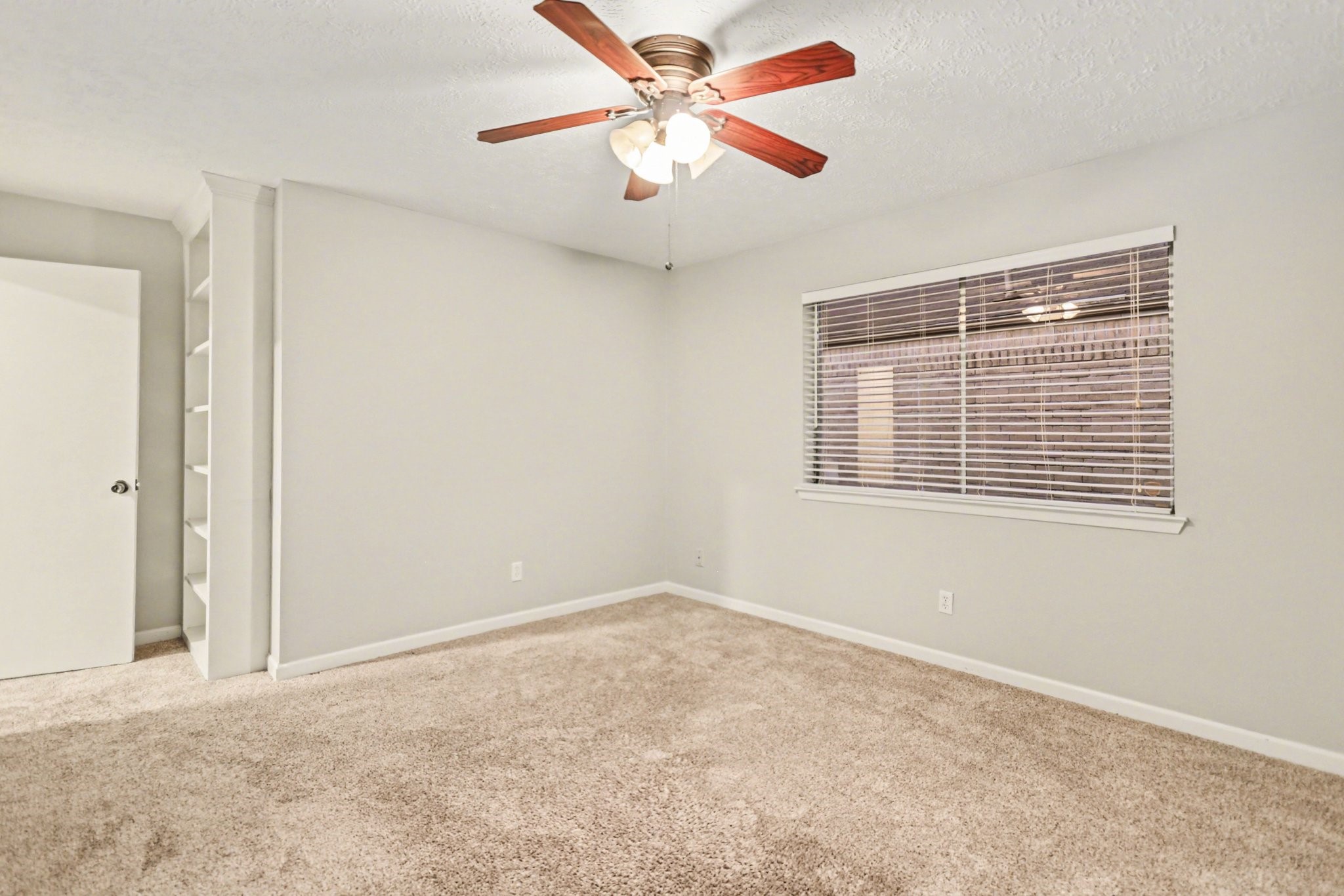 2450 Blackridge Road Houston, TX 77067 - Photo 14 of 21 a view of an empty room with a window