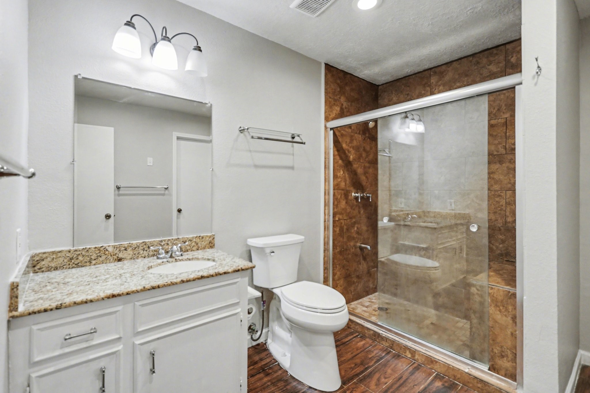 2450 Blackridge Road Houston, TX 77067 - Photo 17 of 21 a bathroom with a granite countertop sink toilet and shower