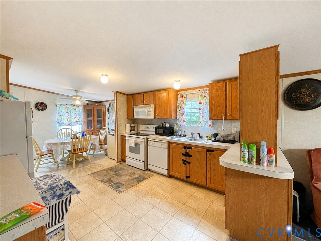 6873 Plank Road Kenbridge, VA 23944 - Photo 6 of 25 Kitchen featuring wood-finish cabinetry, tile floo