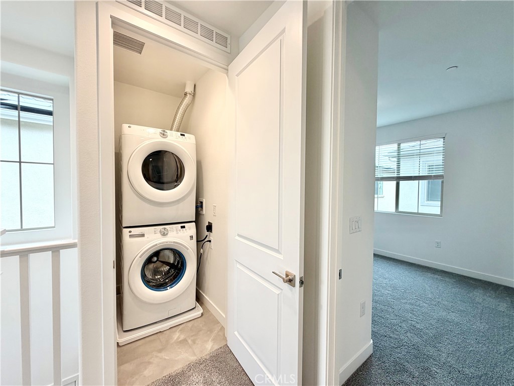 26893 Rubicon Road Menifee, CA 92586 - Photo 15 of 32 a utility room with dryer and washer