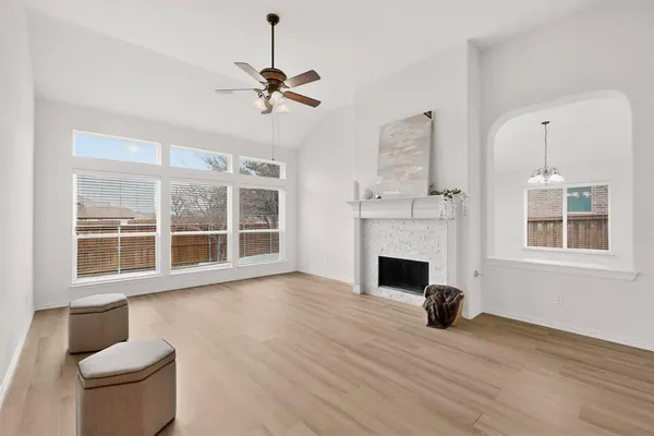 a view of living room with furniture and a fireplace