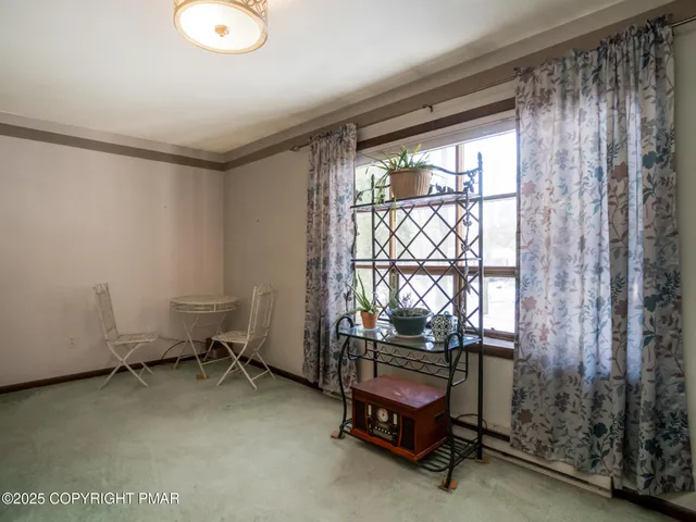 a room with water heater and a window