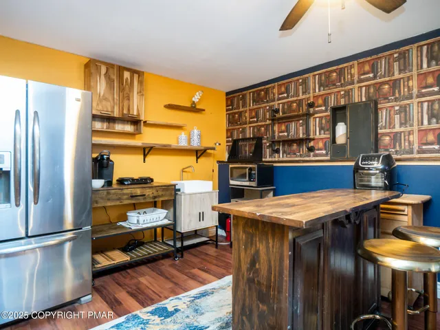 a kitchen that has a table and chairs in it