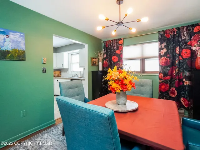 a dining room with furniture and window