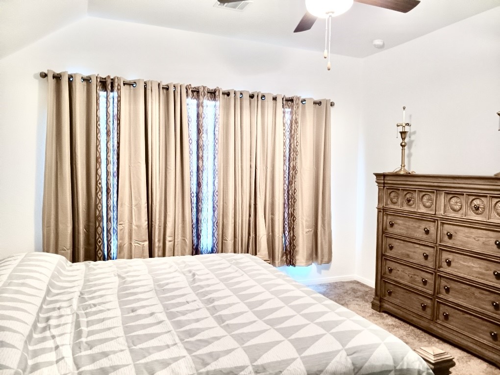 5813 Musquiz Ridge Seguin, TX 78155 - Photo 11 of 15 a bedroom with a bed and a cabinet