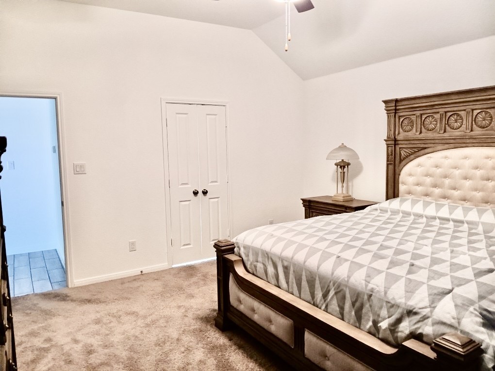 5813 Musquiz Ridge Seguin, TX 78155 - Photo 13 of 15 a bedroom with a bed and a painting on the wall