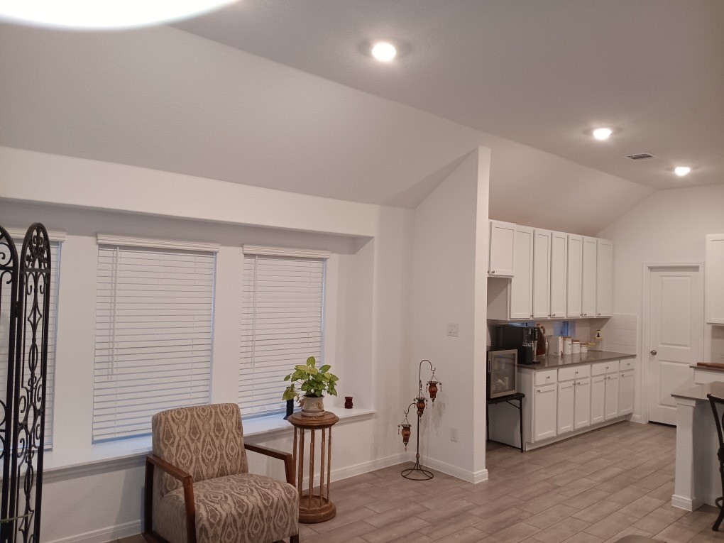 5813 Musquiz Ridge Seguin, TX 78155 - Photo 8 of 15 a kitchen with a refrigerator and white cabinets