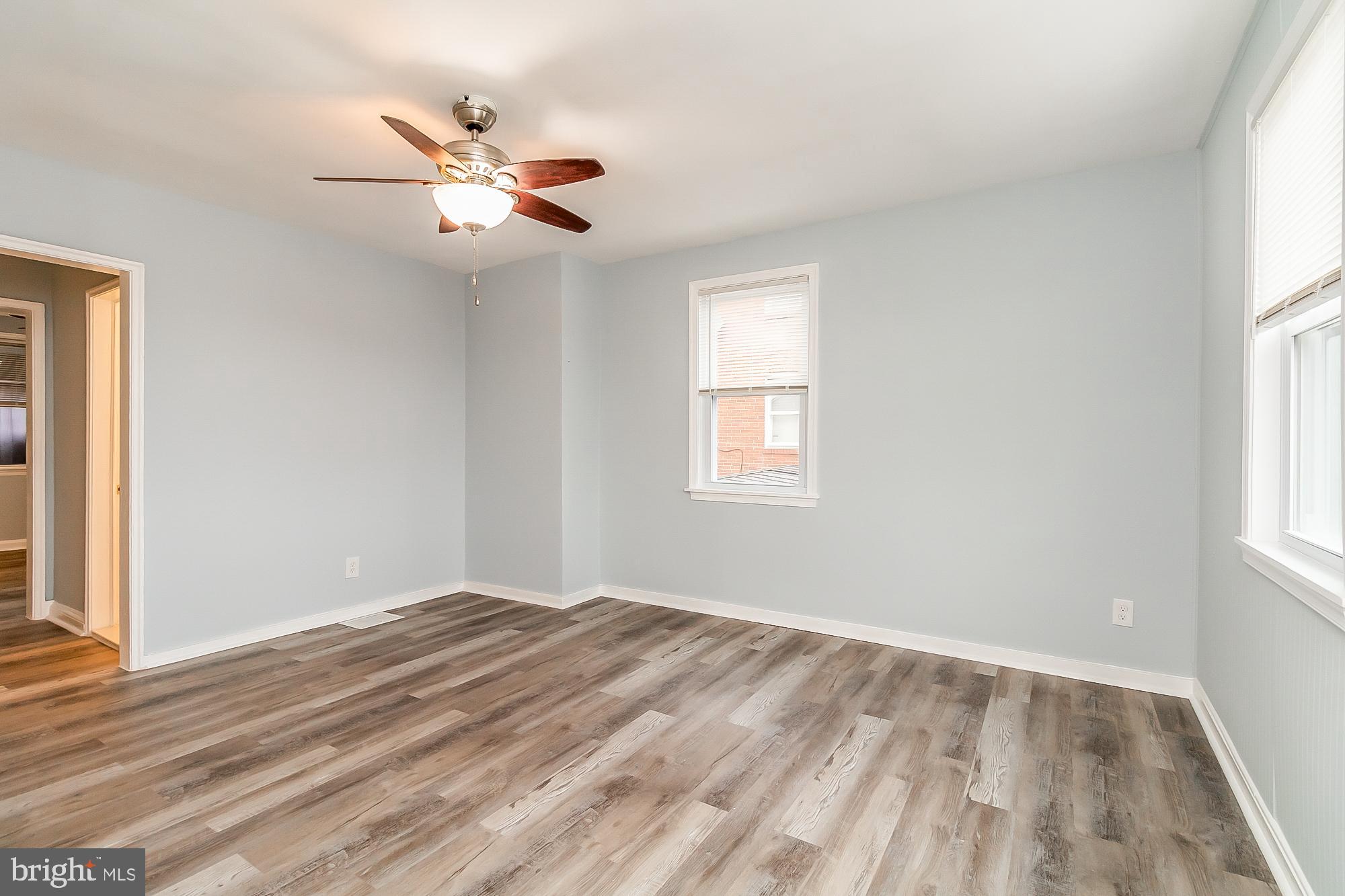 2928 Sollers Point Road Dundalk, MD 21222 - Photo 8 of 41 Living room with new floors and fresh paint