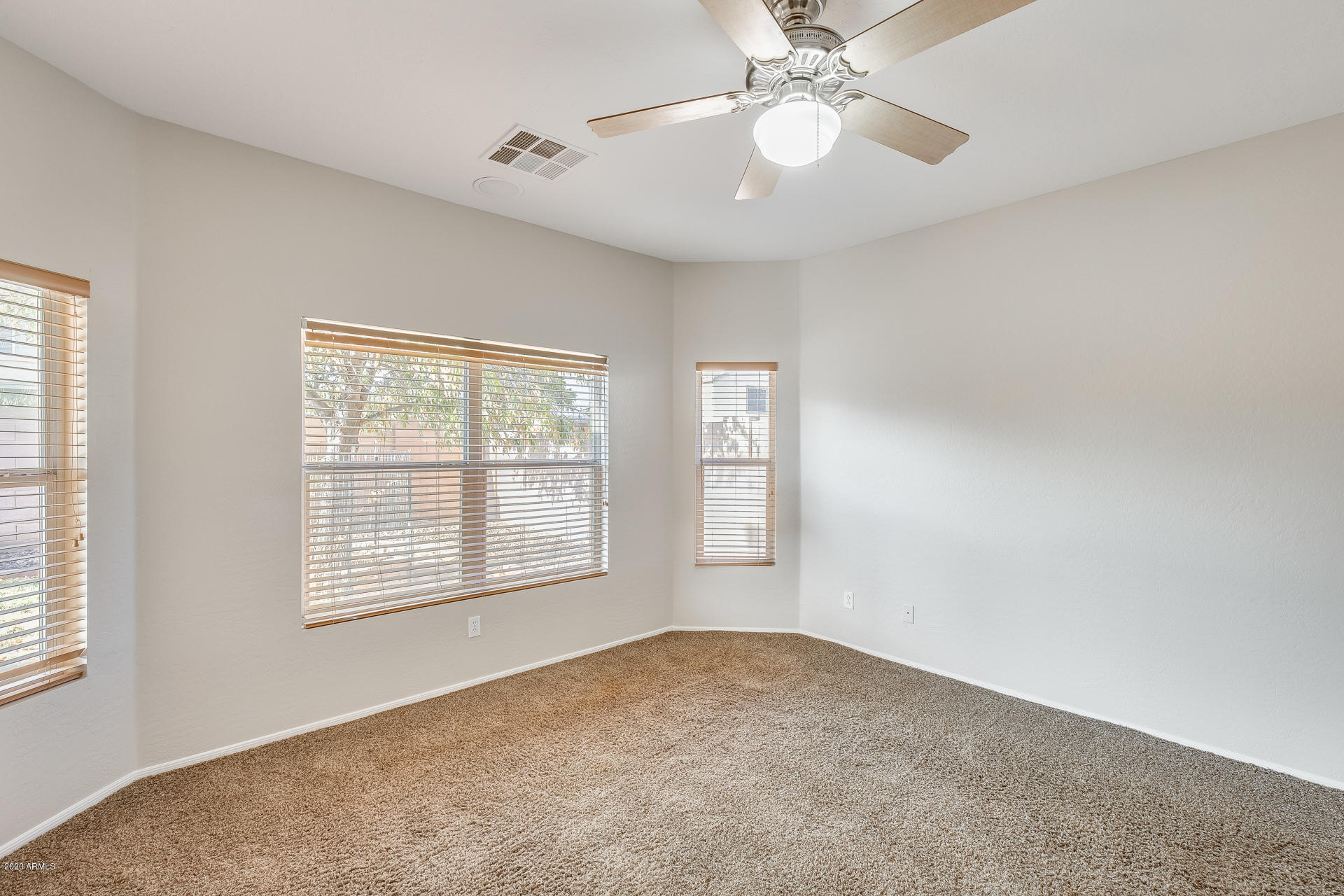 15644 West Calavar Road Surprise, AZ 85379 - Photo 16 of 34 a view of an empty room with a window