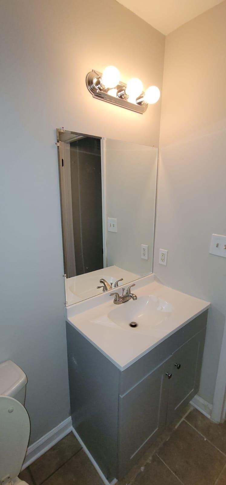 2888 Parrott Avenue Northwest, Unit A Atlanta, GA 30318 - Photo 5 of 21 a bathroom with a sink a toilet and mirror