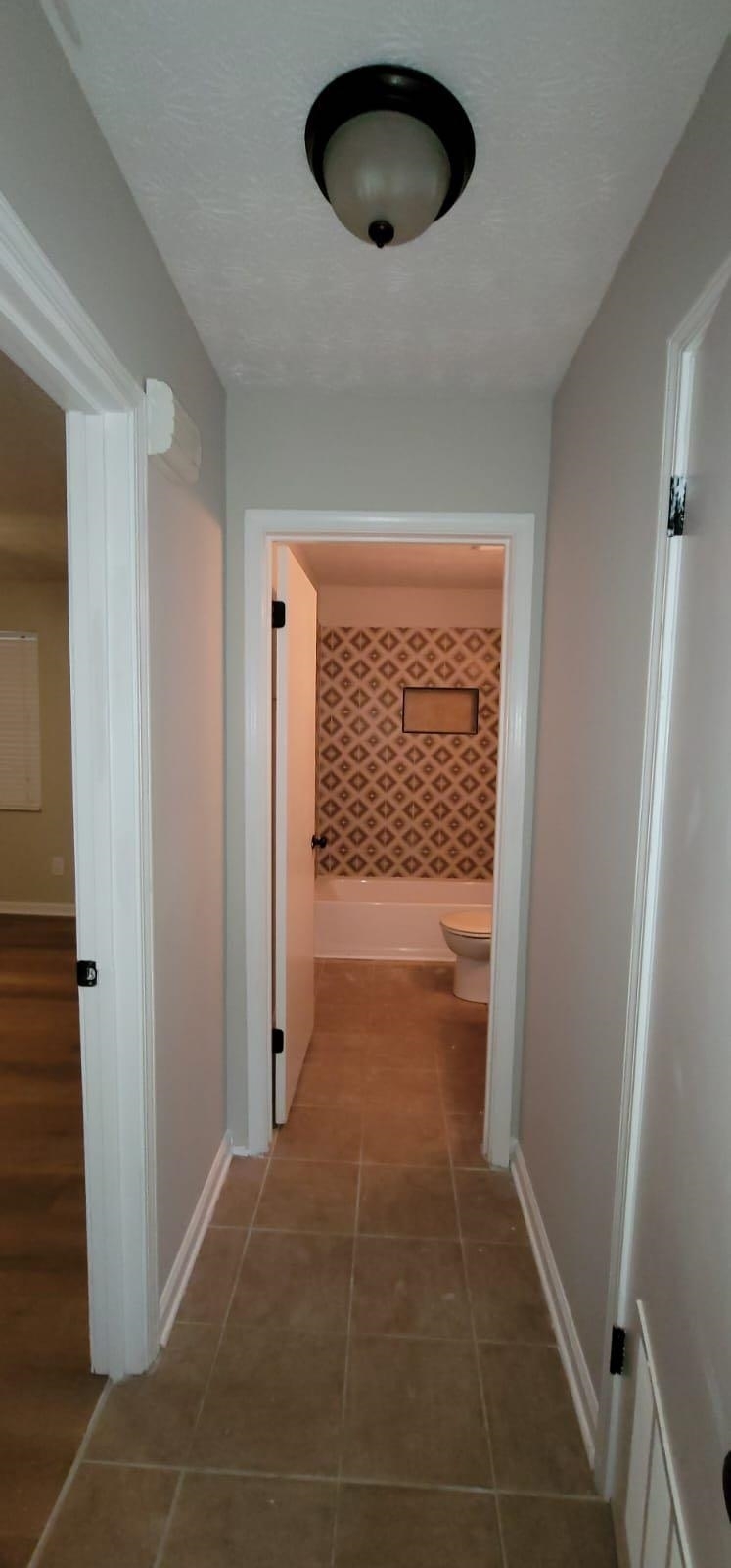 2888 Parrott Avenue Northwest, Unit A Atlanta, GA 30318 - Photo 10 of 21 a view of empty room with wooden floor and fan