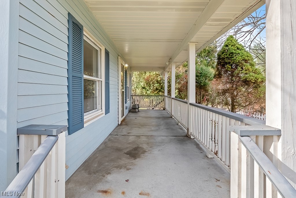 22121 Buck Road Alliance, OH 44601 - Photo 14 of 34 View of patio featuring a porch
