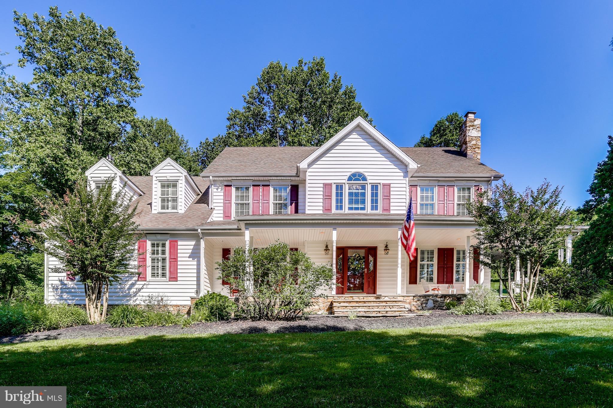 4127 Sharp Road Glenelg, MD 21737 - Photo 1 of 29 Lush vegetation surrounds a beautiful porch