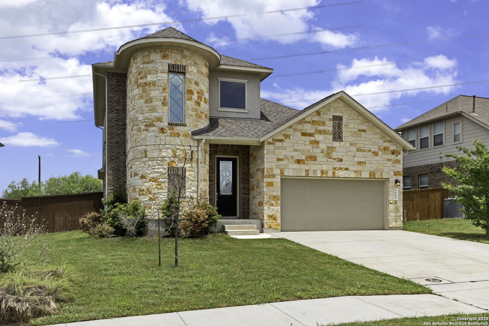 945 Foxbrook Way Cibolo, TX 78108 - Photo 3 of 20 a front view of a house with garden