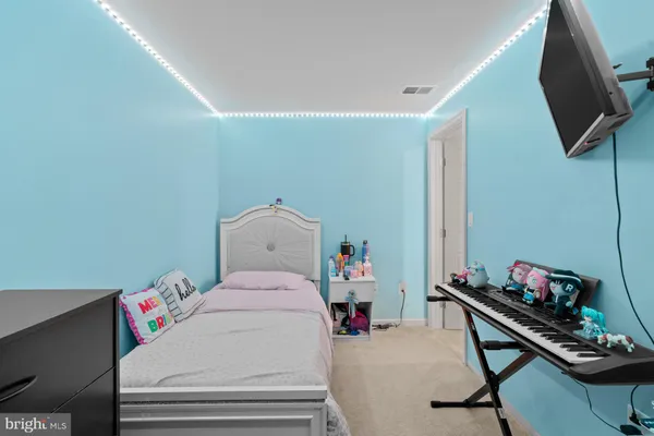 a bedroom with a bed and furniture