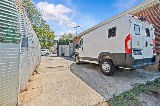 a view of a car parked front of a house
