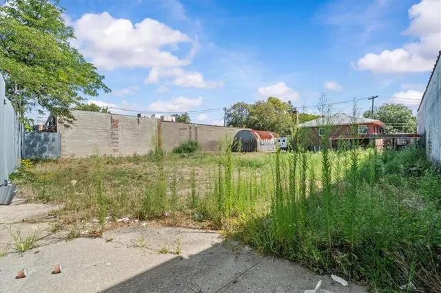 a view of a street with a building in the background