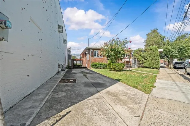 a view of a yard and car parked