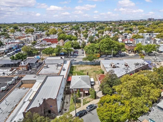 an aerial view of a house with a lake view