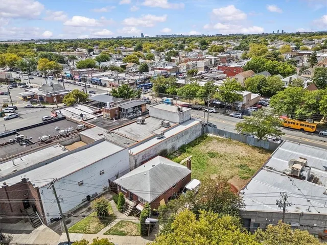 an aerial view of a house with a garden