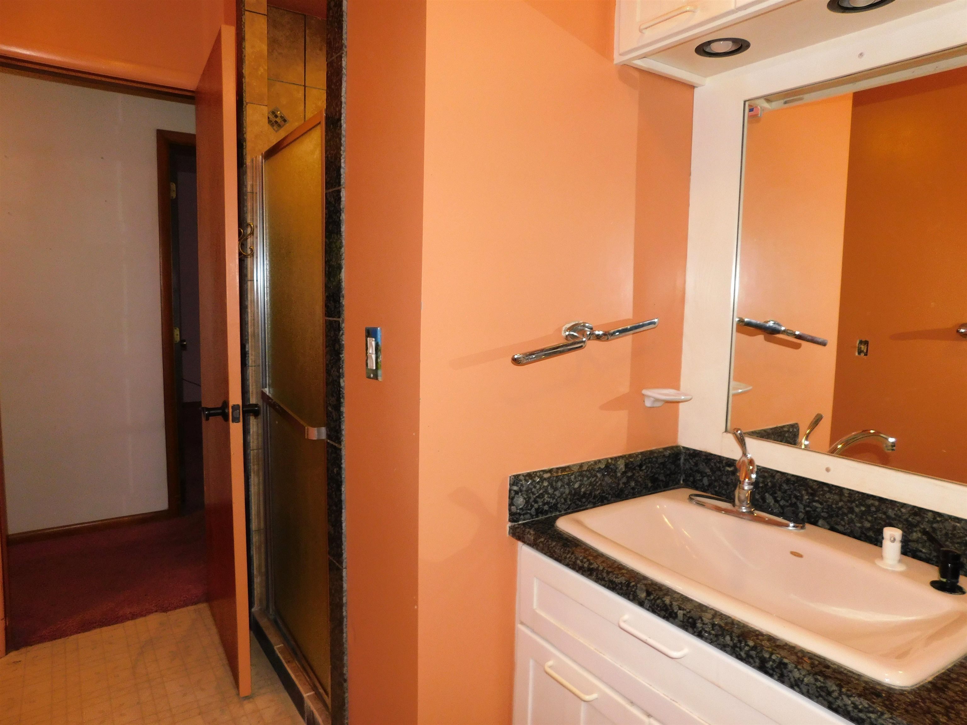 4036 County Rd A Superior, WI 54880 - Photo 23 of 52 Bathroom with vanity and a stall shower