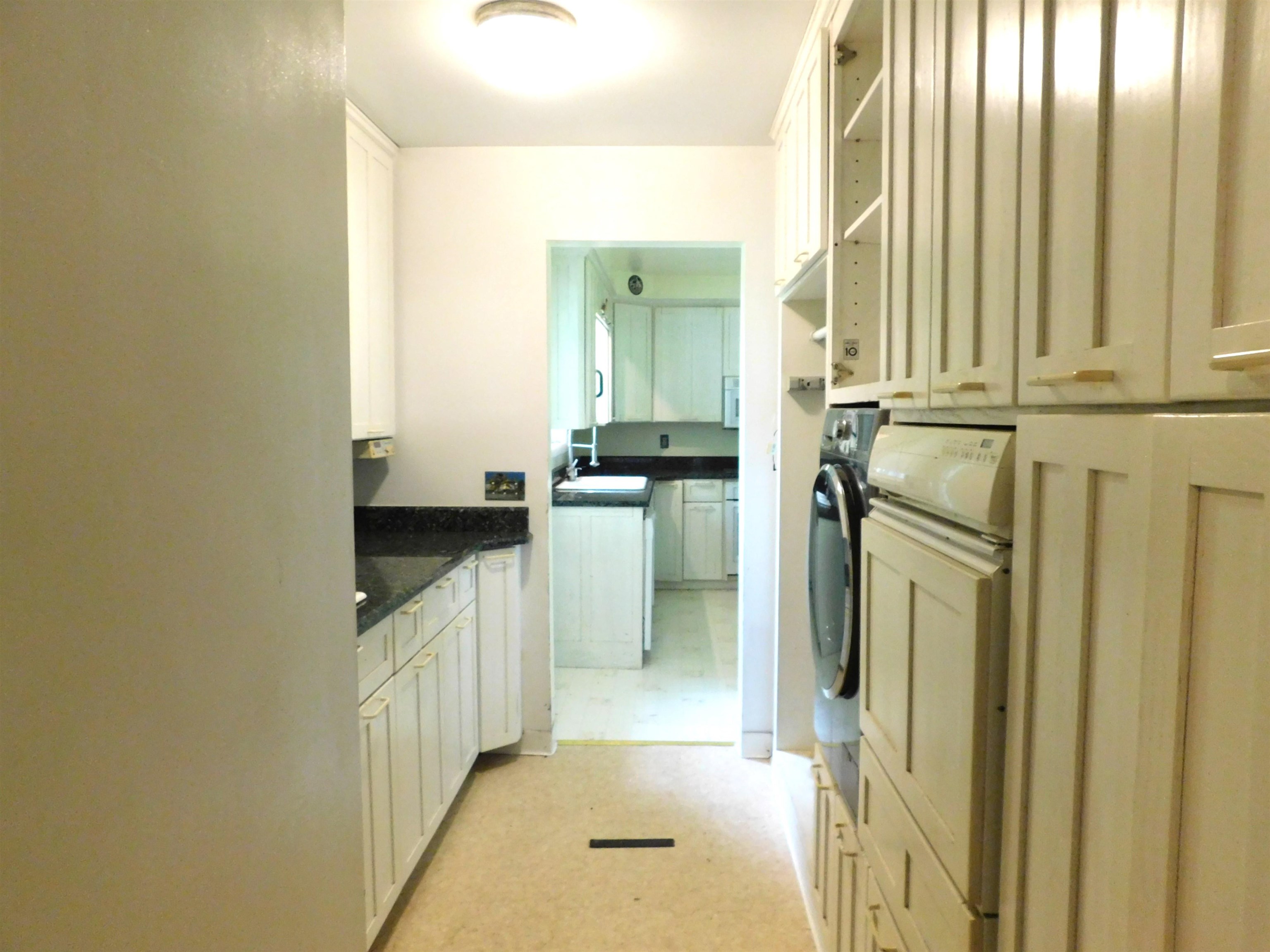 4036 County Rd A Superior, WI 54880 - Photo 29 of 52 Laundry room featuring light flooring, cabinet space, and washer / dryer