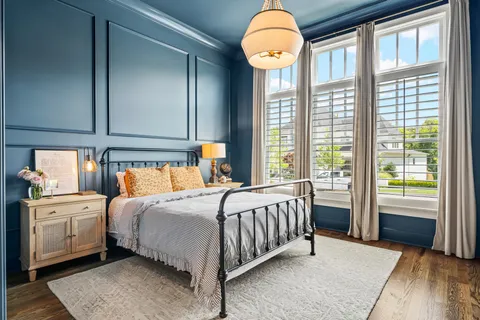 a kitchen with a stove a sink a dining table and chairs