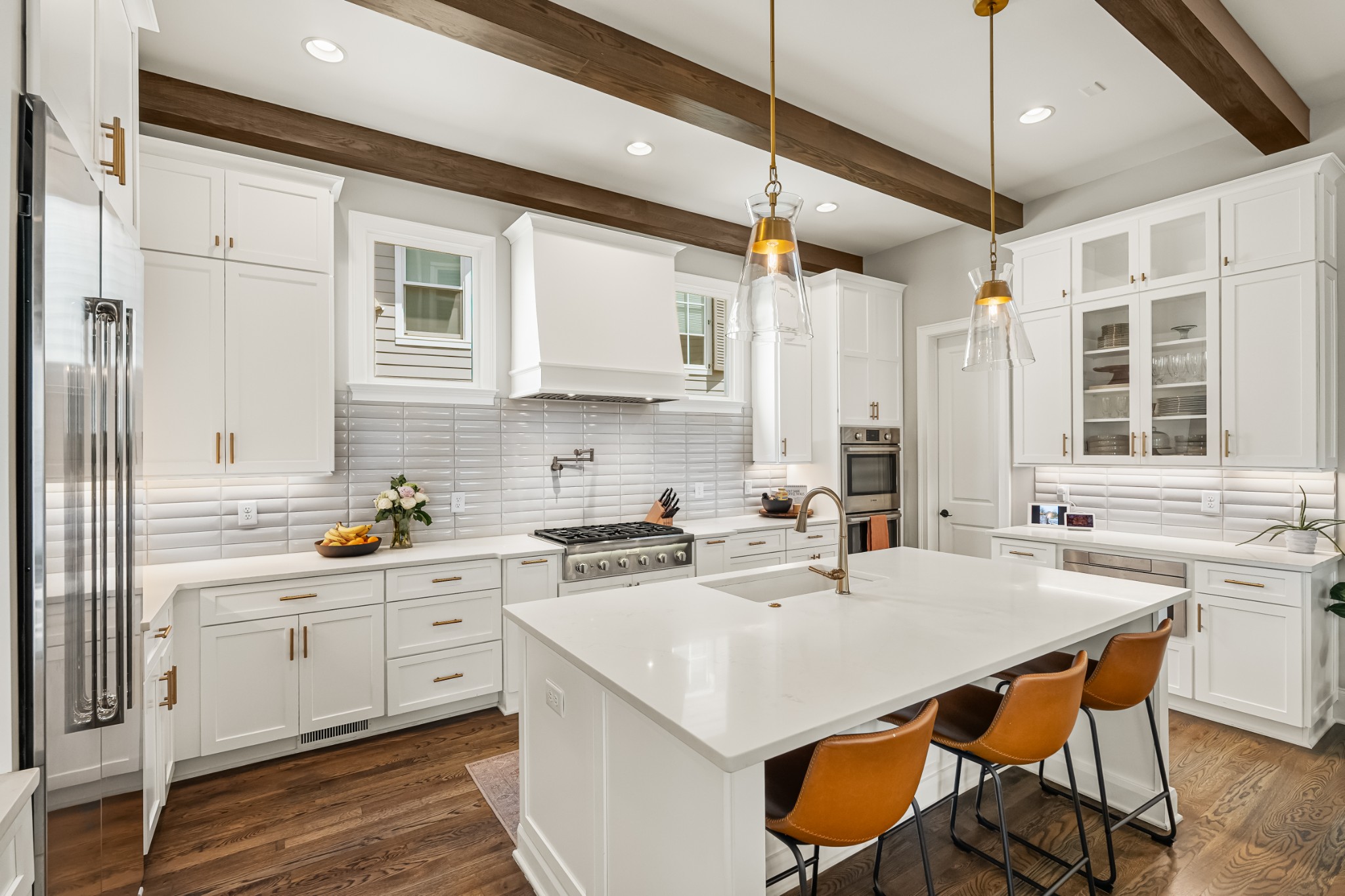 3013 Conar Street Franklin, TN 37064 - Photo 18 of 62 a kitchen with a stove a sink a dining table and chairs