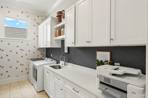 a bathroom with a double vanity sink and mirror