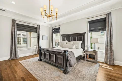a view of a hallway with couch and a dining table