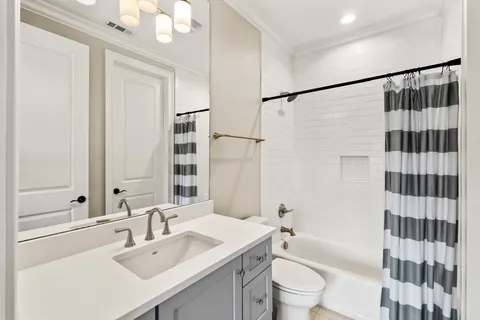 a view of a patio with a dining table and chairs with wooden floor and fence