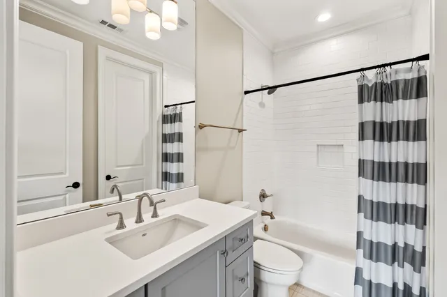 a view of a patio with a dining table and chairs with wooden floor and fence