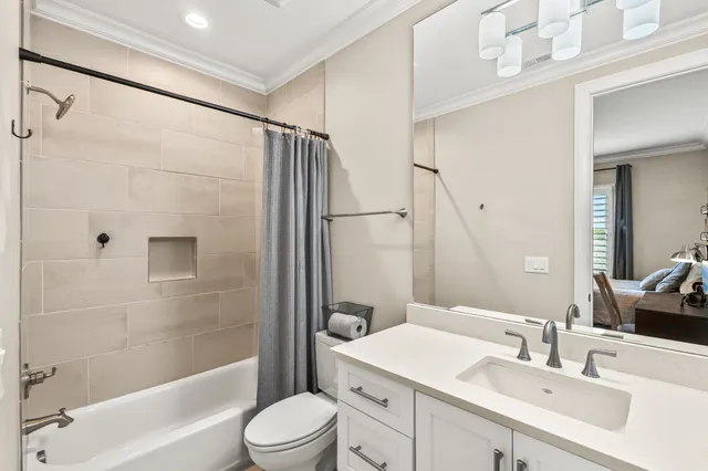 an aerial view of residential houses with outdoor space and river