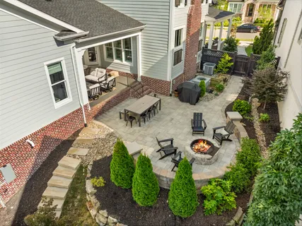a front view of a house with a garden and plants