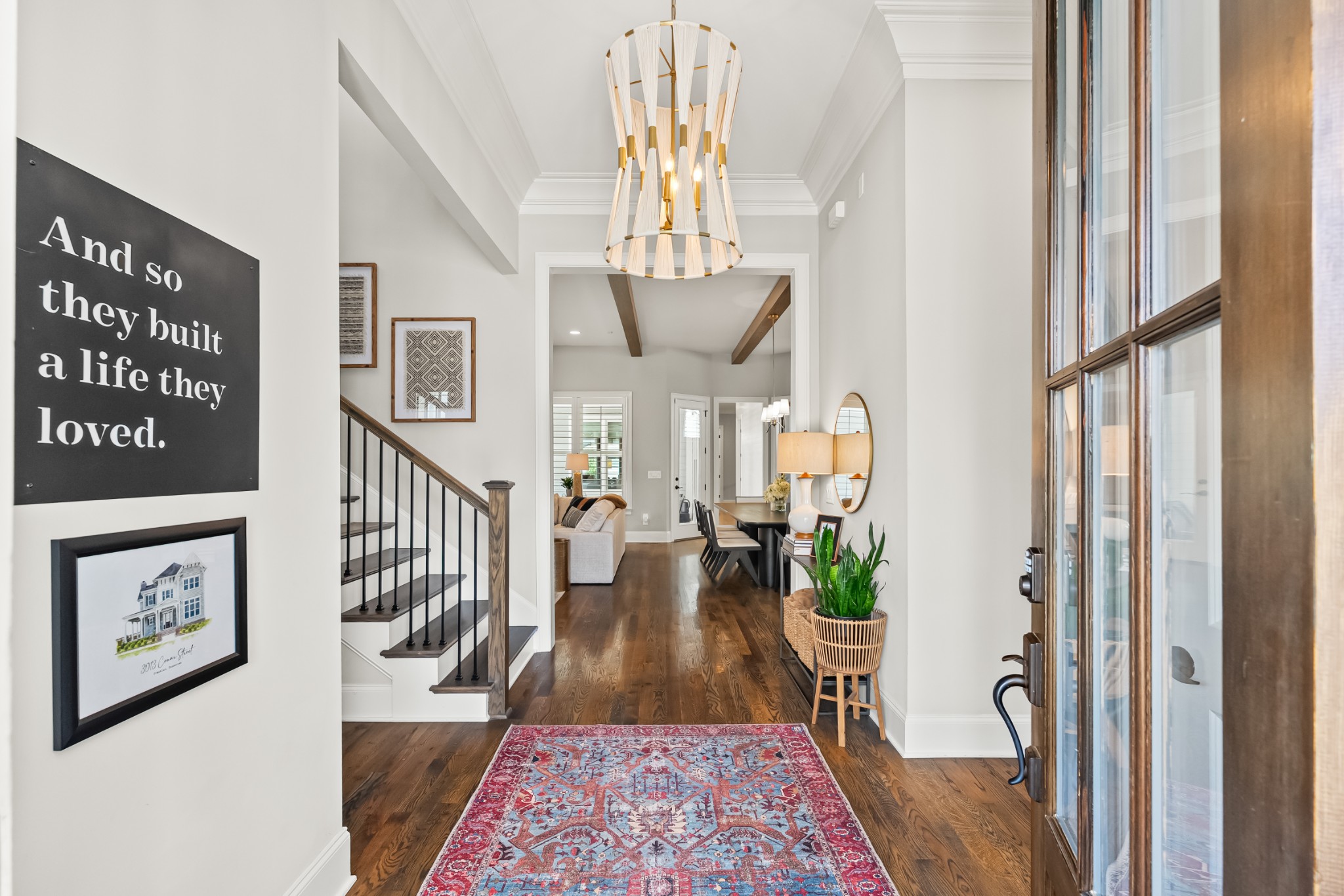 3013 Conar Street Franklin, TN 37064 - Photo 10 of 62 a view of a hallway to a livingroom with furniture wooden floor and a chandelier