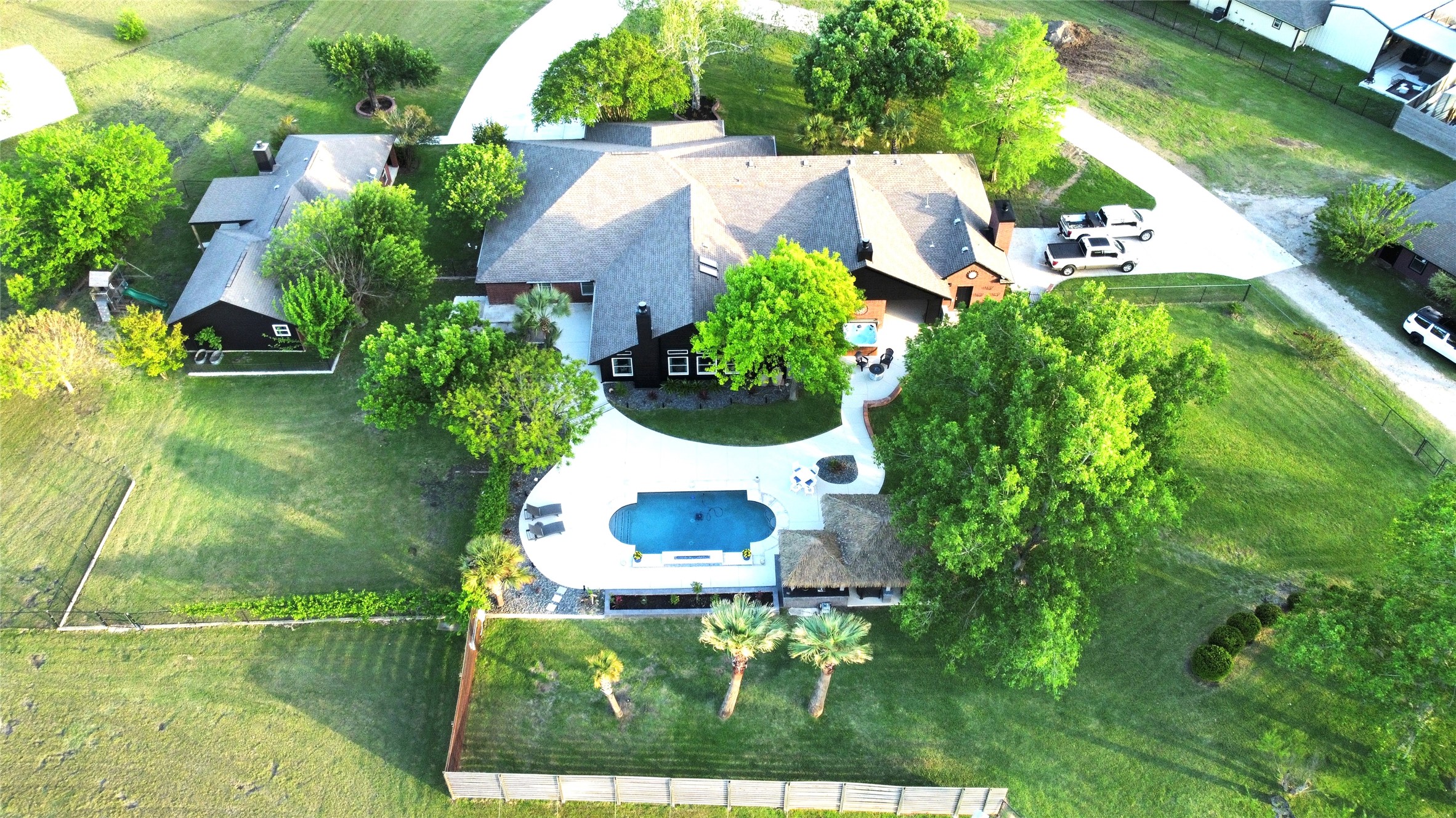 Aerial view of main house, guest house, and pool area