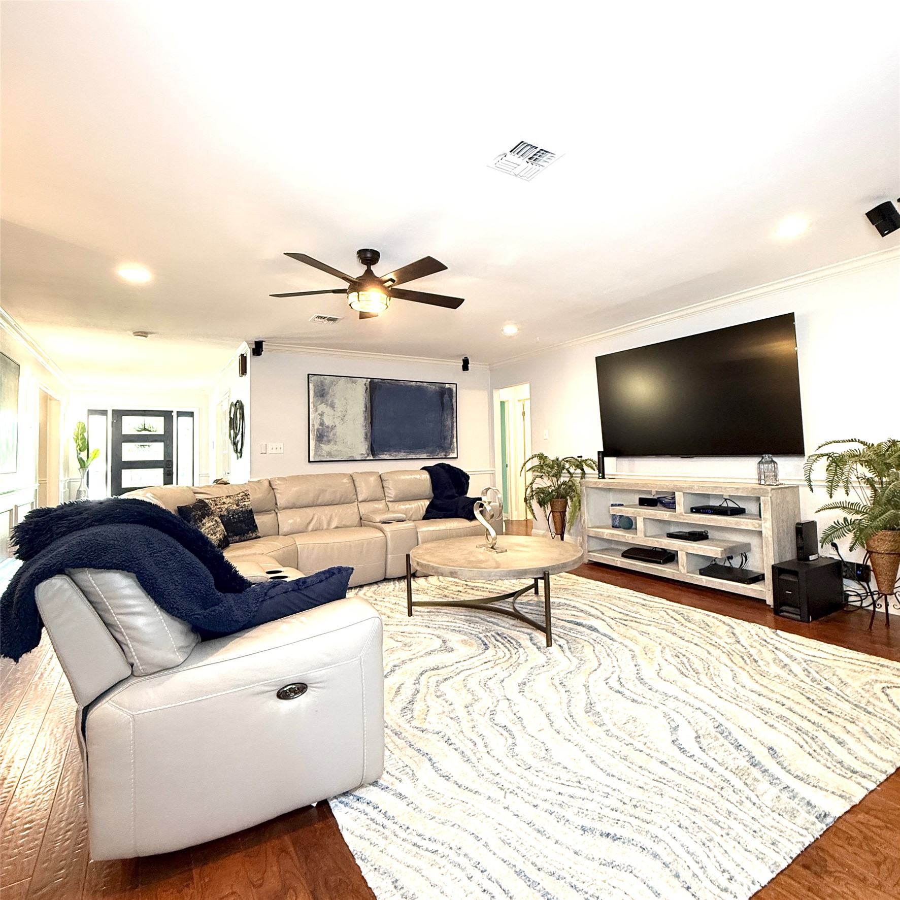 1902 Rowe Loop Pflugerville, TX 78660 - Photo 11 of 38 Living room featuring ornamental molding, dark wood-type flooring, ceiling fan, and recessed lighting