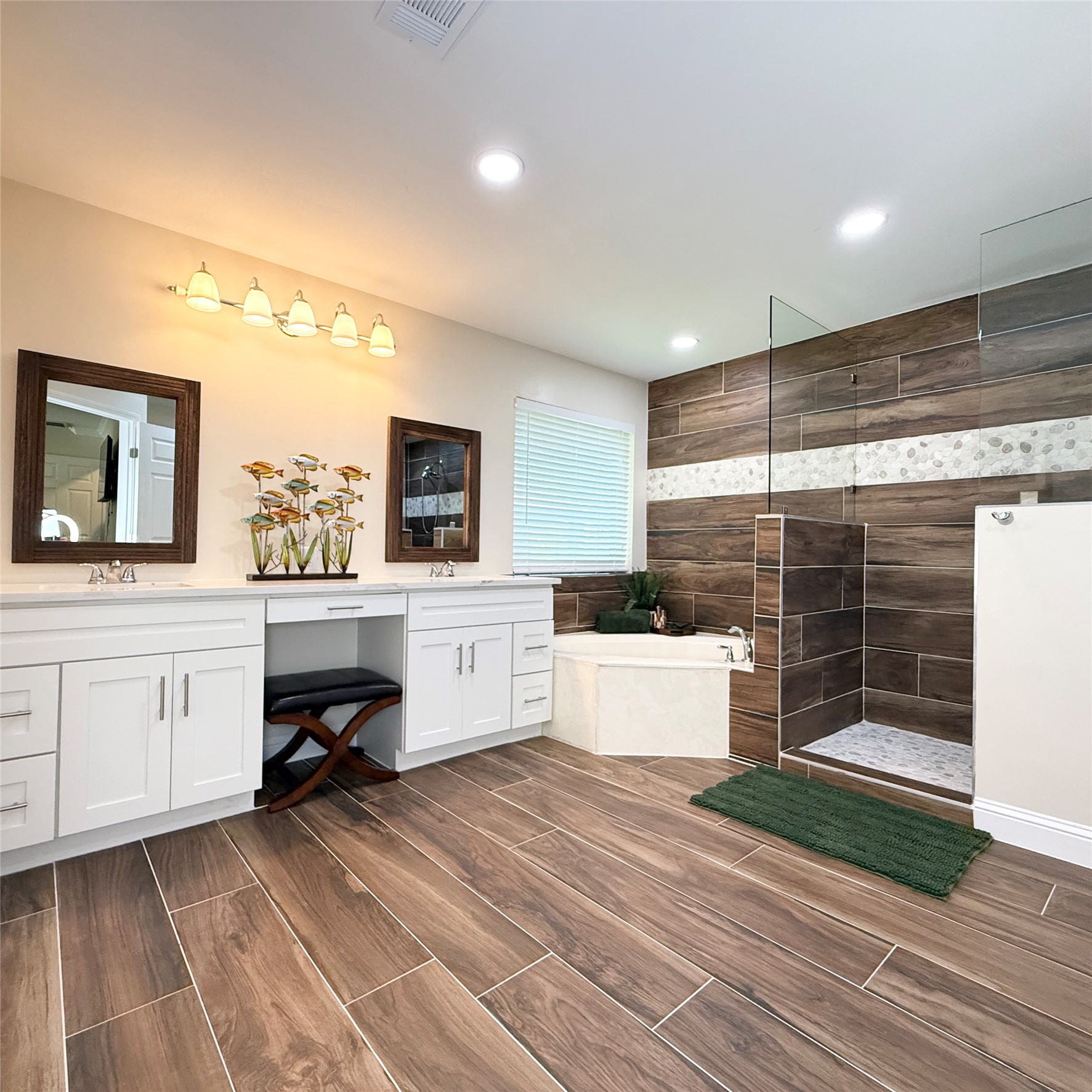 1902 Rowe Loop Pflugerville, TX 78660 - Photo 14 of 38 3rd master retreat ensuite bath featuring vanity, walk in shower, wood finish floors, a bath, and recessed lighting