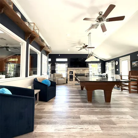 a living room with furniture fireplace and flat screen tv