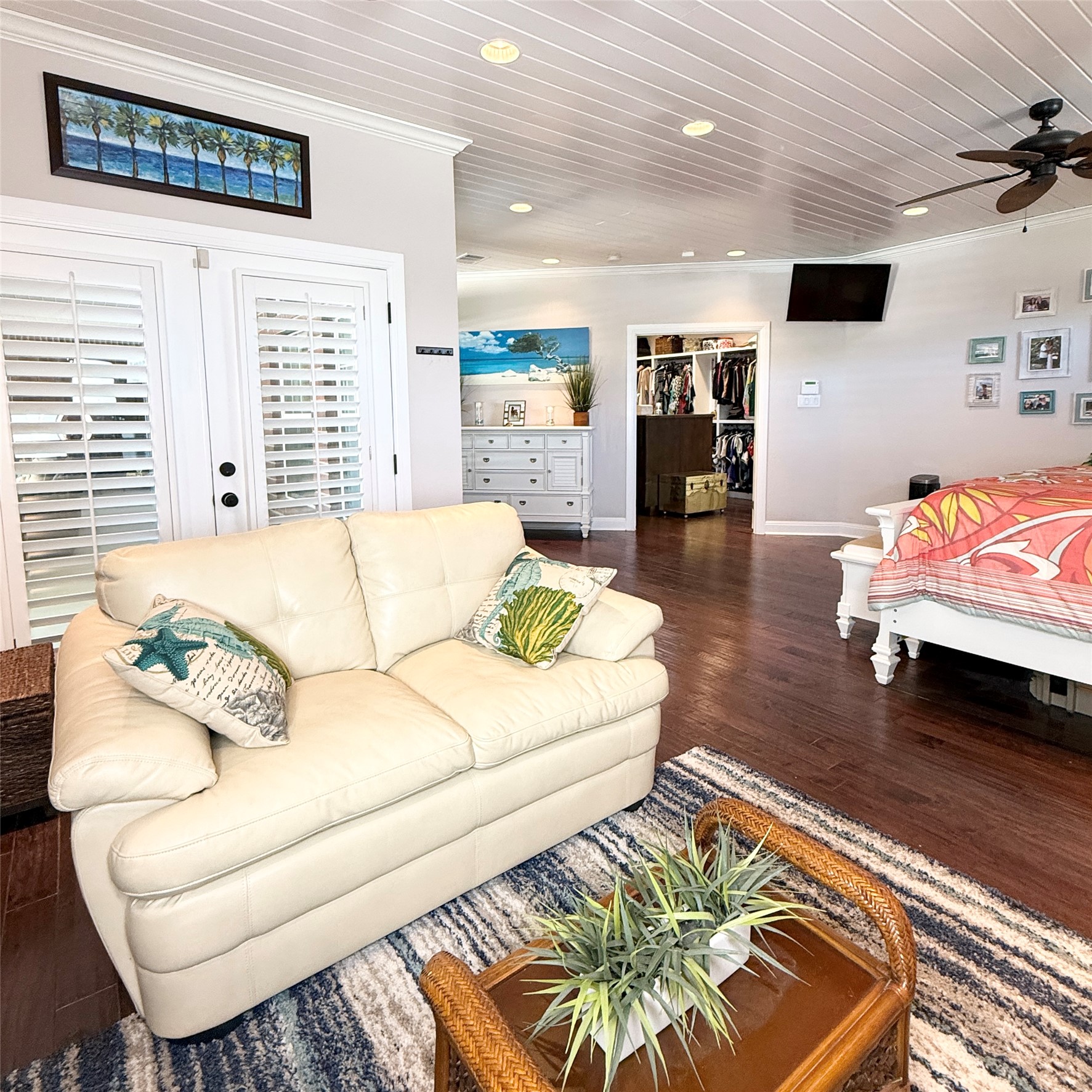 1902 Rowe Loop Pflugerville, TX 78660 - Photo 21 of 38 1st Master retreat Living area featuring wood finished floors, crown molding, ceiling fan, wood ceiling, and recessed lighting