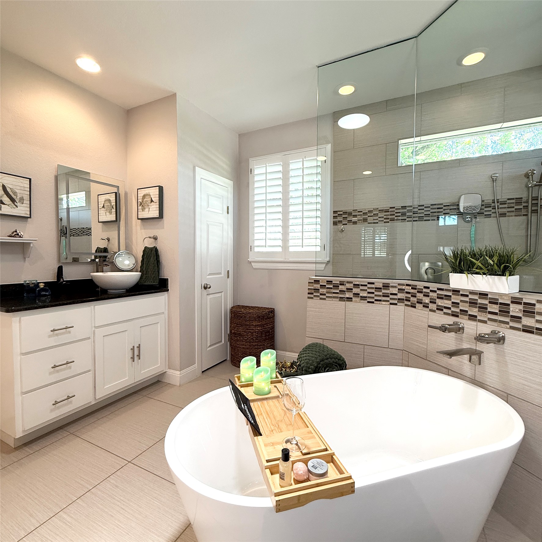 1902 Rowe Loop Pflugerville, TX 78660 - Photo 22 of 38 1st Master retreat Bathroom featuring vanity, a freestanding bath, walk in shower, light tile patterned floors, and recessed lighting