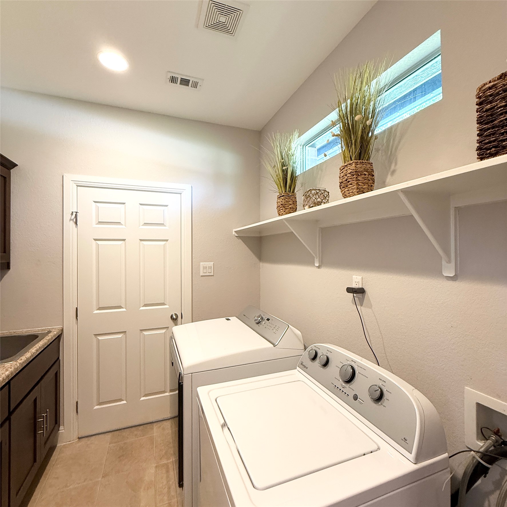 1902 Rowe Loop Pflugerville, TX 78660 - Photo 24 of 38 Closest to 1st and 2nd master retreat Laundry area featuring washer and clothes dryer, cabinet space, and recessed lighting