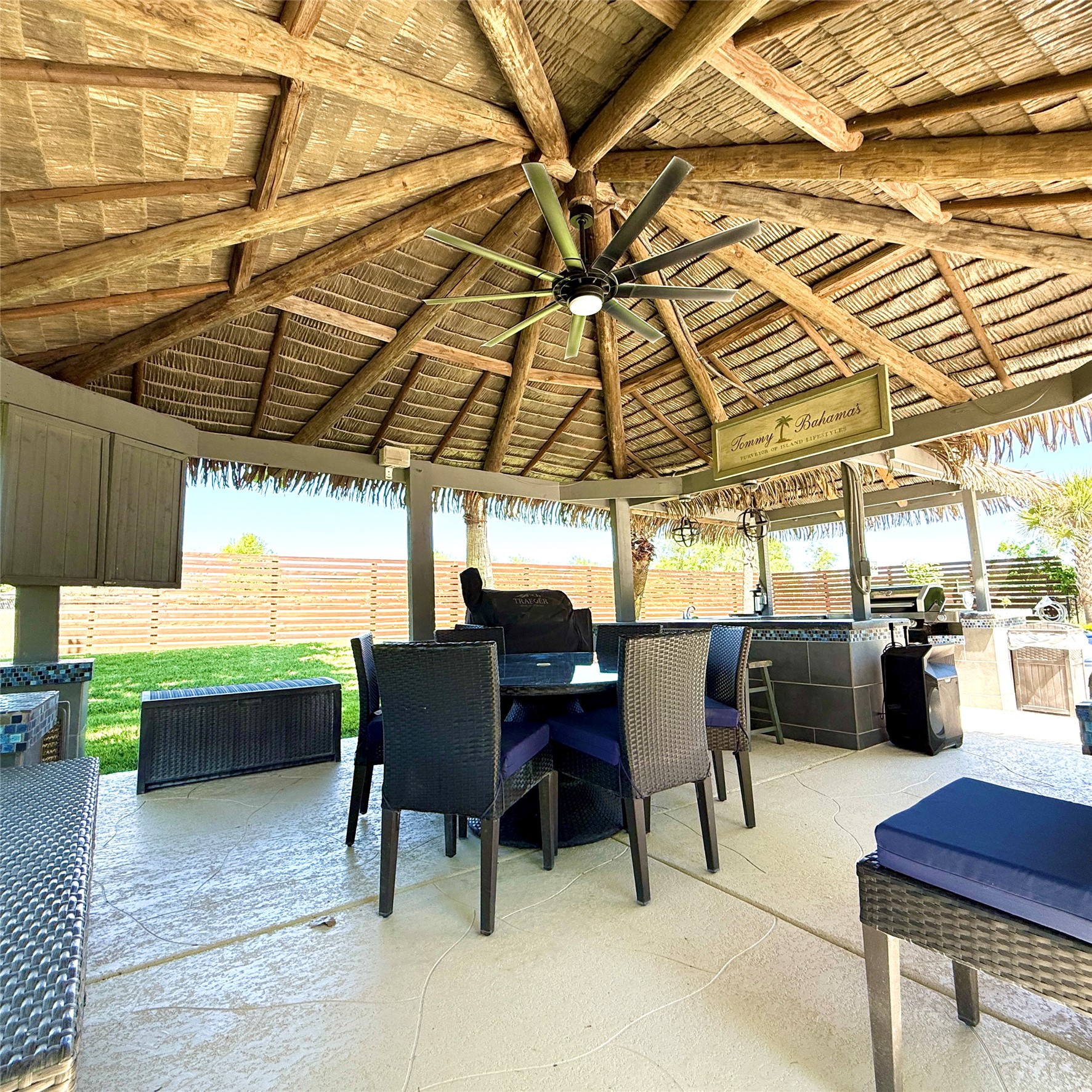 1902 Rowe Loop Pflugerville, TX 78660 - Photo 26 of 38 View of covered palapa area featuring outdoor kitchen and dining space by the pool