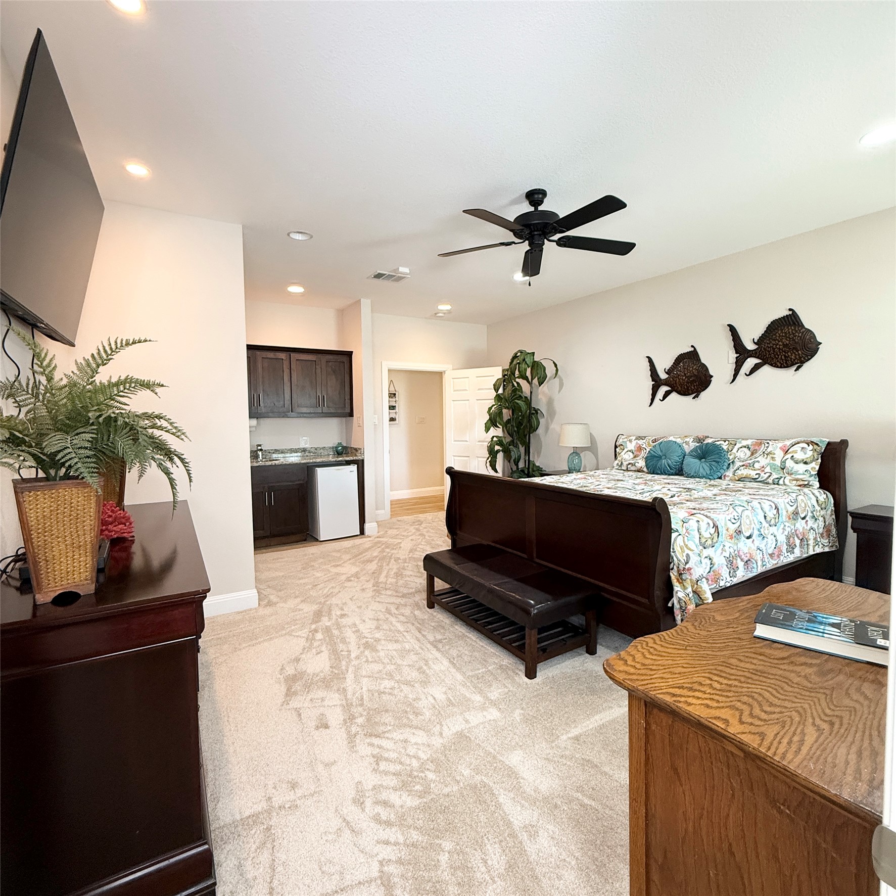 1902 Rowe Loop Pflugerville, TX 78660 - Photo 29 of 38 Master retreat #2 with ensuite bath featuring light colored carpet, ceiling fan, recessed lighting, and white fridge
