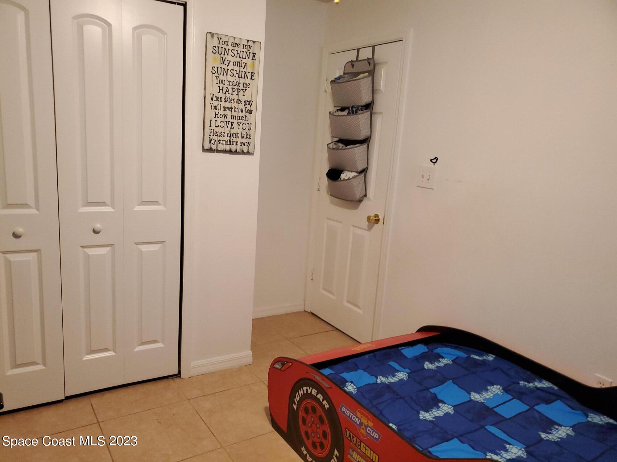 6845 Spring Street Cocoa, FL 32927 - Photo 32 of 45 an empty room with windows