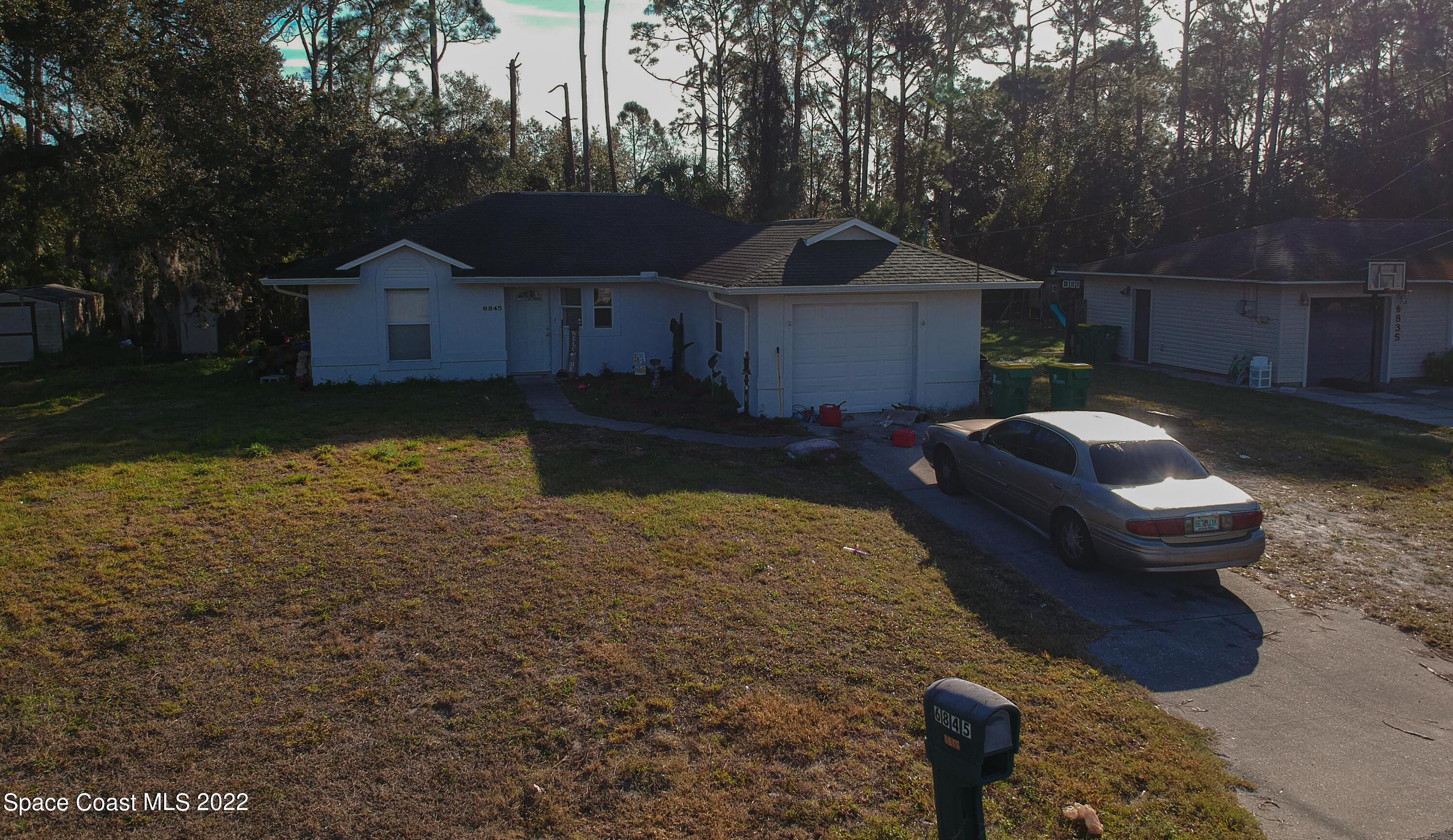 6845 Spring Street Cocoa, FL 32927 - Photo 38 of 45 a house view with a garden space