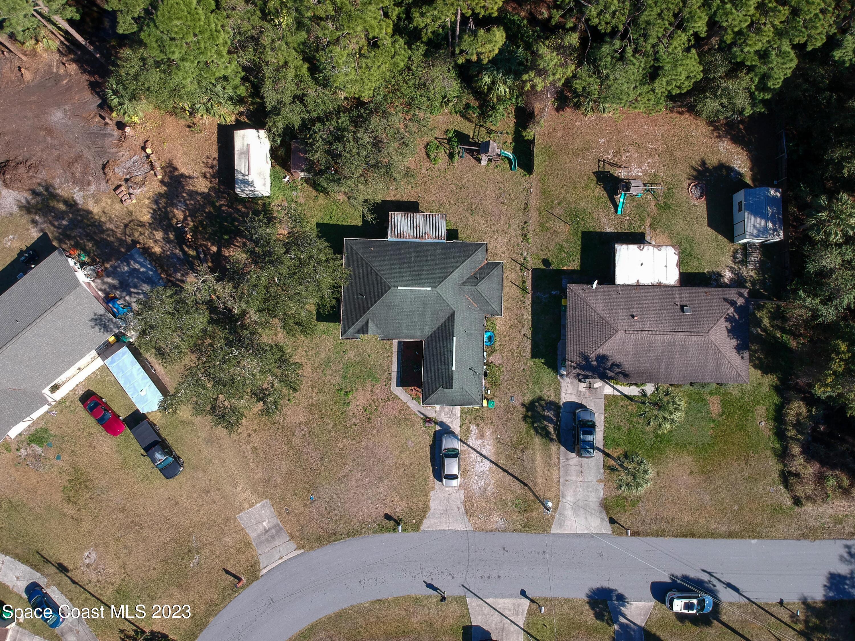 6845 Spring Street Cocoa, FL 32927 - Photo 4 of 45 an aerial view of houses with outdoor space