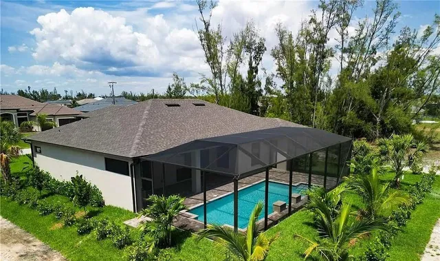 a view of a lake with a house in the background